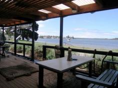54 Haiser Road, GREENWELL POINT Recently refurbished charming four bedroom on the Crookhaven River waterfront reserve
* The private front courtyard is a tranquil getaway from the hustle and bustle of modern life
* The delightful open plan kitchen, dining and lounge room have polished floorboards & R/C air
* The living area flows to the perfect entertainment deck with magnificent waterviews
* An inviting central hallway joins the rear of the house to three courtyards and the living areas
* The house is bagged brick, has a new iron roof, solar hot water and electricity
* A carport is attached to the single garage with a large workshop area for the handyman
