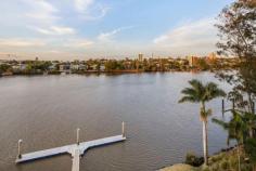4/88 Macquarie Street St Lucia Qld 4067 Please call Jason Adcock to register for private inspections Saturday's and Wednesday's.
With just one apartment per floor, St Lucia's Waterford complex offers
an indulgent rarity - expansive full level living across some 348m2 with
panoramic river views, premier pontoon and pool facilities and a
picturesque position in a truly superlative locale.
Built far out into the riparian, each apartment has been designed to
maximise the views with a sprawling terrace projecting out
significantly, directly towards the water. Not only does this bring a
rare level of privacy but also an uninterrupted 180 degree panorama that
encompasses two wide stretches of the river, parkland, Toowong and the
CBD. Additionally, being on the fourth floor, this particular apartment
enjoys an almost perfect elevation - high enough to elicit far-reaching
views but close enough ensure a strong connection with all the goings on
of the river.