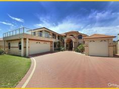 15 Clarecastle Retreat Mindarie WA 6030 EXECUTIVE MARINA LIFESTYLE LIVING THE BEST OF BOTH WORLDS On Mindarie's most exclusive premier street with beaches literally at your door step this Executive home is in the perfect location ideal for the perfect lifestyle and with dual waterside frontages. This double storey manor has all you could want. Containing 5 Bedrooms (with both Kingsize Master bedroom & "new" Guest Bedrooms upstairs & remaining 3 minor bedrooms downstairs), 4 Bathrooms, 4 separate Living areas - Formal Lounge, Family / Sun room to ground floor and Sitting/Lounge retreat and separate Guest Living area to upstairs, Study, downstairs Dining/Meals area adjacent to centrally positioned large country Kitchen. An upstairs front balcony provides ocean views whilst the rear patio & living overlook the Marina, the private pool and private boat mooring. View online or simply contact the agent for a complete list of inside features. In summary; you won't be disappointed by the fine finishings, fittings, fixtures and treatments t/out this lovely home. Starting with the Grand Entry leading through to main downstairs Living areas, the passages & Living areas downstairs are all tiled with ceramic tiles with the remaining Bedrooms and upstairs Living areas finished off with quality carpets. High ceilings dominate the home and include decorative bulkhead and ornate cornicing. Other features include; all ducted evaporative & a single split reverse cycle A/C, ducted vacuum Valet & Security Alarm systems t/out, carpeted stairs with steel balustrade leading to upstairs Living, Master & Guest Bedrooms & Study. The country style Kitchen is complete with; a range of quality appliances, Corian tops, dishwasher to stay, plenty of storage and much more. Outside features are many and can also be viewed in detail online. Key features; access to outdoor areas via the Family room leading to; a covered paved patio area (with Café blinds) and down again to the lower boat mooring decks. The other side of the home allows for an additional covered entertainment area, with Ocean & Marina views from the various vantage points including the large balcony over the front garage - with views to Quinns Beach. Your exclusive Boat Mooring can be seen from the perfectly positioned rear Living areas - all with captivating views. The backyard is all easy care paved with terraced landings and pebble gardens back & front—all well established, reticulated and with some water features. To the front is a double auto lock-up garage + extra space behind front fully enclosed courtyard with auto steel gates, in addition there is a large boat store / 3rd garage / workshop with ample storage ideal for any large vehicle / good sized boat. This beautiful home is contained on a large 1,174 sqms terraced block - opp walkways to Mindarie/Quinns Beach and surrounded by other similarly priced & exclusive homes. This home must be viewed to be fully appreciated therefore contact Ray to view strictly by appt today.