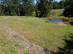 This nicely elevated 6,443 sq.mtr. block has plenty to offer. There is a
great building site overlooking the land and it is nicely set back from
the road. There is also a dam for extra water and the block is in a
rural setting but less than 10 minutes from the main Bruce Highway.
Another feature is that the building site overlooks a lovely rural
setting.