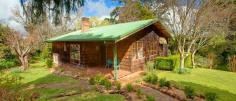 51 Church St Burrawang NSW 2577 4 Bedrooms For Sale : $749,000 HIGHLANDS COTTAGE Situated in the historic township of Burrawang, this two-level cottage has so much character to offer ... external shingles, vaulted ceilings, two fireplaces plus slow-combustion fire, polished boards, English paned windows and more! There are four bedrooms, two living areas, a study space and a mezzanine above the lounge, as well as a country-style eat-in kitchen with welcoming corner nook. Every window offers leafy views of the English-style garden with stepping stones and enchanting places to sit and ponder. The home faces due north and catches tons of winter sun. The large ¾-acre block and a double auto garage complete this attractive package. Just listed today! Viewing by appointment. Outgoings per annum: Council: $ T.B.A Water: $ T.B.A