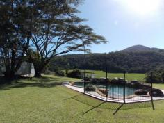 194 Gray Road Green Hill Qld 4865 33 Acres of Untouched Paradise just 20 minutes to the City As
soon as I walked onto this property my mind went into a complete calm
and I could think of nothing else but the vista in front of me. The
green rolling hills blending into the rainforest on the outskirts, the
fenced paddocks with sheds built waiting for the horses and the creek
meandering through the middle. Little did I know it but there were
still many more surprises all hidden away. We entered the
rainforest which is national parkland, completely untouched and a whole
new world. Wandering through I felt privileged as I am sure not many
people would ever get the chance to experience the sheer beauty of this
untouched world. The creeks running through all turned and twisted
heading in different directions but each one more picturesque than the
next. The huge trees had those trunks that are wide and sleek and you
cannot help but appreciate their lines. The higher you go the more
beautiful it is. Back into the land stretching in front of us we
then drove to a higher area which gave a whole different perspective on
the landscape and quite literally took my breath away. This would be
the perfect place if someone wanted to build a new home or possibly a ... show more View Sold Properties for this Location View Auction Results