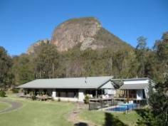 2225 Lake Moogerah Road Moogerah QLD 4309 Executive style property on 73 acres Basking in the grandeur of Mt Greville, Zengarra is situated in the heart of the Scenic Rim. The current Owners have developed and improved the property over the past 9 years, but now wish to downsize and have instructed us to sell. Zengarra is all about self - sufficiency, privacy and the preservation of the environment. Situated within it’s bush surroundings, it is easy to believe you are a million miles away from the city. In reality the property is a mere 6km from the Cunningham Highway and a 70 minute drive from Brisbane. Zengarra’s thoughtfully devised layout ensures it is the perfect residence for entertaining. Features include: • Three individually styled luxury suites, each with ensuites • Separate pavilion with a distinct oriental influence contains the lavish master suite including a spa & walk in robe • Living areas with 5 metre high cathedral ceilings and fire place • Commercial kitchen with top of the range appliances throughout • Acoustically balanced, multi - purpose studio • Solar heated, in-ground pool • Covered deck overlooking the pool • 33m x 9m steel frame shed • Orchard with an abundance of fruit. General Features Property Type: House Bedrooms: 4 Bathrooms: 4 Land Size: 29.54ha (73.00 acres) (approx) Outdoor Features Open Car Spaces: 10 $849,000