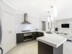 13 Drysdale Cres Point Cook VIC 3030 The ultimate entertainer!LJ Hooker Point Cook presents 13 Drysdale Crescent, Point Cook. Showcasing high-end quality with striking features, this home will quickly make you the envy of family and friends. Feel like you're on holiday all year-round by taking advantage of diverse entertaining options, including an alfresco, deck and L-shaped swimming pool set within established gardens. Inspect at this Saturday's open or contact the agent for more information. - Featuring four bedrooms plus separate study, including a large master bedroom with parents' retreat, his/her walk in robes and a stylish en suite with twin vanity and oversized shower. - Bedrooms two, three and four are located down a separate hallway and are all equipped with built in robes. - Spacious living areas are well positioned, including a home cinema room with double door entry, open plan dining/family area adjacent the kitchen and a large living room overlooking the pool and garden. - Designer kitchen complete with elongated bench tops, stainless steel appliances including under bench oven, gas cooktop and range hood, glass splash back, dishwasher, walk in pantry, good-sized fridge cavity and feature lighting. - Glass sliding doors from the family room open up to a paved alfresco and separate deck, offering multiple entertaining options all-year round. - Large grassed area and established planting surround the custom-designed swimming pool with mood lighting and water feature all set on a generous 645m2 block (approx). - Multitude of luxury features including double garage with remote control, ducted heating, evaporative cooling, two stacked stone feature walls complete with down lights, high ceilings and quality window furnishings. Located only 22km from Melbourne's CBD in Innisfail estate, this home is conveniently located near parks and playgrounds, childcare, primary and secondary schools. Within walking distance to local amenities including Boardwalk Central shopping centre and a short drive to Point Cook Town centre and Williams Landing train station, this home is sure to impress.