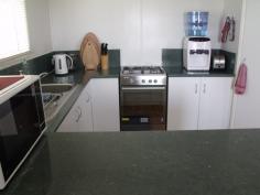 35 Ivy Street Roma QLD 4455 Looking for that neat and tidy home with nothing to do in a quiet street? then this is it! 3 good size built-in bedrooms, great open plan living areas. Modern kitchen with new stove, pantry, 1 1/2 bowl sink and breakfast bar. Evaporative air conditioning throughout, gas bayonet for heater, fully screened plus security doors, linen and broom cupboards. Rain water tank and large garden shed, 2 bay carport, 6 ft colourbond fencing complete the outside picture. $337,000