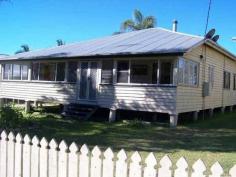18 Kent Street Bororen QLD 4678 ABSOLUTE BARGAIN! This cosy timber Queenslander home is situated close to the local Bororen School and is within a short stroll to the shops. Stepping up 4 steps you are greeted in an enclosed sunroom that offers great extra living space. Down the hallway it opens up into the living and dining area that features an combustion heater. The kitchen is tucked away just off from the living and dining area and offers timber bench tops, free standing oven, breakfast bar window. Two large bedrooms with built in robes and one fitted with air conditioning. Extra bedrooms have been made to suit your family. Vibrant large bathroom provides bath, separate shower & ample storage space. Outside features a huge undercover entertainment area that flows seamlessly into the backyard. Above ground pool and rock fire BBQ is great for those hot summer days shared with friends and family. Tranquil pond with small bridge leaping over it, adds that extra special touch! Side access with extra shed space at the rear and single carport tops it off. Easy access to the Highway and a 25 minute drive to Tannum Sands. View Sold Properties for this Location View Auction Results General Features Property Type: House Bedrooms: 2 Bathrooms: 1 Land Size: 1100 m² (approx) Outdoor Features Garage Spaces: 1 Swimming Pool - Above Ground Other Features Above Ground Pool, Close to Schools, Entertaining Area, Established Gardens, External Water Feature $222,000