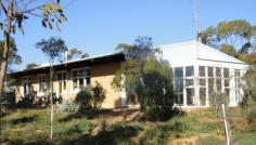 190 RING ROAD, Morgan, SA, 5320 If low cost living and wide-open spaces appeal to you, this property is
definitely worth a closer look. With well-established native trees and
lots of room for your furry friends, this 12.5 acre property is ideally
located only 4.5 km from the township of Morgan & the Murray River.
The property boasts a solid & comfortable 3-bedroom mud brick home,
24 kL water tank capacity, numerous sheds, animal enclosures, and a dam.
The home is built from locally crafted mud bricks, making it cool in
summer and warm in winter, with exposed timber beams recycled from the
Port Adelaide woolsheds adding to its earthy ambience. The home has 3
bedrooms, each with built-in wardrobes, a kitchen/dining room, a large
walk-in pantry, living room, sunroom, laundry, bathroom, separate
toilet, and a wrap-around veranda.
There are no utility bills to pay, as solar panels provide all the
necessary power, and if you ever run out of solar-heated hot water,
there is always the back-up gas heater. Staying toasty warm in winter is
easy thanks to the slow combustion wood fire heater & the natural
insulation provided by the mud brick walls.
The sale of the property comes with a licence to pump 500 kL annually
from the nearby Murray River, plus a registered water truck, this means
an abundant and constant water supply that is cheap & easy to
access.
For the past 20 years this property has been a sanctuary for the sick,
injured or orphaned wildlife of the Riverland region. The animal
enclosures are ideally suited for this purpose or they could be easily
adapted for other uses.
All the hard work has been done. Now it’s time for someone else to
shape this property into their own vision of eco-friendly living in the
vast expanse of the South Australian Riverland.