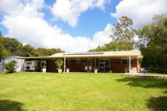 30 Witta Road Maleny Qld 4552 Set at the rear of this 7589m2 block (almost 2 acres) this low set brick
home has been specifically sited to take advantage of the expansive
north facing views. This is a very special piece of land and subject to
new Council regulations and approvals a second dwelling may be
permitted. The existing home has four large bedrooms all with built-ins.
Huge views from the kitchen which is combined with the family meals
area and the separate lounge room has a pot belly stove. There is a
large laundry and utility area with good storage. The spacious rear
entertainment area takes advantage of the magnificent outlook. There is a
20,000 gallon water supply, lock up garage, steel shed & undercover
caravan parking. There is also plenty of room to keep horses other
anaimlas or build a huge shed. Less than 10 minutes drive into Maleny
privacy is guaranteed at this address.