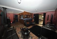 6 Bullock Ave Chester Hill NSW 2162 Auction 29/11/2014 at 11:30 AM Property: House Bldg: Aluminium Clad Land: 626 Sqm Council: Bankstown Age: 65 Rooms: Lounge/Living Family Room Dining Room Other Areas: Laundry Area- Internal Balcony(s) Pergola Local Amen: Schools Railway Station Bus Service Shops Sports Field & Club Child Care Centre Playground Park Zoning: RESIDENTIAL Furnished: N FAMILY HOME IN A FAMILY LOCATION. A spacious tidy clad house situated on the higher side of the street in a lovely whisper quiet cul-de-sac. The home provides three (3) bedrooms with one having a built-in robe. There is a separate lounge leading to a dining room onto an updated kitchen. Provides two (2) modern bathrooms, one (1) of which has a corner spa bath. For the entertainer this home boasts a large rear family room that features a fantastic timber wet bar, air conditioner and a fireplace, making it an all year round sensation. There is a partly screen enclosed patio and a pergola off the back laundry. Has a wide driveway through a double carport into a single lock up garage with a storage loft. Quietly nestled in a lovely quiet cul-de-sac, ideal for the young family and on a 626m2 block. Has dimensions Irr 17.07/28.04 x 29.72/27.58m.