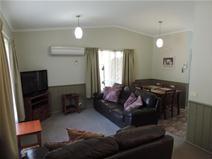 6/16-10 Gavan Street, Bright VIC 3741 REDECORATED & STYLISH - UNIT 6 ‘SILVER BIRCHES’ $275,000 This delightful unit in the Silver Birches complex has recently been very tastefully redecorated and renewed. Comprising an open plan lounge, dining & kitchen area, 2 bedrooms with BIR’s, modern bathroom, laundry & undercover parking for 1 vehicle. Boasting new carpets, soft furnishings and a modern interior colour scheme. Fully furnished & self contained. In immaculate condition in a superbly presented & well managed holiday unit complex with in-ground pool, outdoor kitchen & dining area. Excellent investment for your own holidays & rental return.