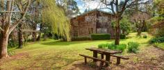 51 Church St Burrawang NSW 2577 4 Bedrooms For Sale : $749,000 HIGHLANDS COTTAGE Situated in the historic township of Burrawang, this two-level cottage has so much character to offer ... external shingles, vaulted ceilings, two fireplaces plus slow-combustion fire, polished boards, English paned windows and more! There are four bedrooms, two living areas, a study space and a mezzanine above the lounge, as well as a country-style eat-in kitchen with welcoming corner nook. Every window offers leafy views of the English-style garden with stepping stones and enchanting places to sit and ponder. The home faces due north and catches tons of winter sun. The large ¾-acre block and a double auto garage complete this attractive package. Just listed today! Viewing by appointment. Outgoings per annum: Council: $ T.B.A Water: $ T.B.A