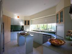 Bermagui NSW 2546 Enjoy the space and quality of a gracious sized residence, and the convenience of townhouse living including an internal elevator. With only 2 townhouses in this complex, this 4 bedroom (plus 3 living areas) townhouse is ideally located close to beach, river and shops. Top Storey: Up high and with expansive outlook the top storey is a large library or sunroom retreat with tea making area, bathroom and a balcony with views to Montague Island, Gulaga (Mt Dromedary), Bermagui River and town. First Floor: Spacious, open plan (main) living/dining area, commercial chef’s kitchen, main bedroom with full bathroom (including double spa bath) and 4th bedroom or home office plus powder room. Ground Floor: Configured for use as guest quarters as well as kitchen space for the outdoor entertaining area and with internal access, exterior courtyard with BBQ, kitchen, large Jacuzzi and wine cellar. Remote double garage with internal access.