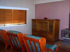 18 Kent Street Bororen QLD 4678 ABSOLUTE BARGAIN! This cosy timber Queenslander home is situated close to the local Bororen School and is within a short stroll to the shops. Stepping up 4 steps you are greeted in an enclosed sunroom that offers great extra living space. Down the hallway it opens up into the living and dining area that features an combustion heater. The kitchen is tucked away just off from the living and dining area and offers timber bench tops, free standing oven, breakfast bar window. Two large bedrooms with built in robes and one fitted with air conditioning. Extra bedrooms have been made to suit your family. Vibrant large bathroom provides bath, separate shower & ample storage space. Outside features a huge undercover entertainment area that flows seamlessly into the backyard. Above ground pool and rock fire BBQ is great for those hot summer days shared with friends and family. Tranquil pond with small bridge leaping over it, adds that extra special touch! Side access with extra shed space at the rear and single carport tops it off. Easy access to the Highway and a 25 minute drive to Tannum Sands. View Sold Properties for this Location View Auction Results General Features Property Type: House Bedrooms: 2 Bathrooms: 1 Land Size: 1100 m² (approx) Outdoor Features Garage Spaces: 1 Swimming Pool - Above Ground Other Features Above Ground Pool, Close to Schools, Entertaining Area, Established Gardens, External Water Feature $222,000