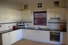 19 Bennett Street Inverell NSW 2360 FOR SALE: $215,000 Property Description Motivated Vendors! This well presented home is an opportunity not to be missed! 2 spacious b/rs, sleepout & office, ideal for owner occupiers or investors alike with a current rental income of $280 p/w. Features include a modern kitchen with stainless steel appliances, spacious living with gas heating, decorative high ceilings, large laundry & tidy bathroom. Covered entertaining area with 2nd toilet, 7 × 7 m shed with power & attached skillion, garden shed, 2 × 3m dog kennel, colorbond fencing with feature gate, low maintenance gardens & 1012 m2 block with privacy. Conveniently located to store, schools, clubs & sporting fields. whether nesting or investing this is a fantastic home! Vendors instructions are to GET IT SOLD. Property Features Land Area 1,012.0 sqm