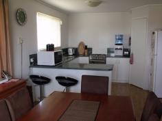 35 Ivy Street Roma QLD 4455 Looking for that neat and tidy home with nothing to do in a quiet street? then this is it! 3 good size built-in bedrooms, great open plan living areas. Modern kitchen with new stove, pantry, 1 1/2 bowl sink and breakfast bar. Evaporative air conditioning throughout, gas bayonet for heater, fully screened plus security doors, linen and broom cupboards. Rain water tank and large garden shed, 2 bay carport, 6 ft colourbond fencing complete the outside picture. $337,000