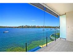 2/11a Oyama Avenue Manly NSW 2095 HARBOURFRONT PARADISE To live on the foreshores of Sydney Harbour, looking across a view-swept swimming pool and beautifully manicured harbourfront lawn, must be the ultimate dream. Just a short stroll from Manly's ferry terminal, at the end of a quiet seaside cul-de-sac, this spacious 2 bedroom Waterfront apartment presents a wonderful Lifestyle opportunity. Part of a small boutique building, with secure garaging and sandy beaches just footsteps away, this property enjoys breathtaking main harbour views to Forty Baskets Beach and beyond. The sunny aspect and prime front-row position enjoy a never-ending parade of yachts and pleasure-craft where you'll really have to pinch yourself to believe it's all yours... Seeing is believing ! *** BE SURE TO VIEW OUR AMAZING 2min VIDEO TOUR ONLINE AT maxwalls.com/id178