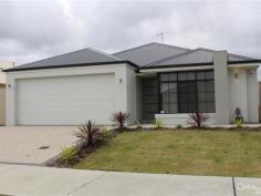 10 Buttermere Approach Waikiki WA 6169 STYLISH HOME IN HARRINGTON WATERS ESTATE WITH ALL THE EXTRAS Quality built Easy Start constructed home only 9 months old and set in the sought after Harrington Waters Estate. This home is beautifully presented and has quality fittings and fixtures throughout plus all the extras - evaporative air-conditioning, monitored alarm system, good size minor bedrooms all with double built in robes. Master bedroom has a walk in robe and en-suite with separate toilet. Home theatre, open plan family meals kitchen with feature 31 course ceilings, island bench to kitchen, 900mm wide oven and gas hot plate, dishwasher, double fridge recess and a dishwasher. Great storage space to laundry and inbuilt sink with cupboard space, alfresco under main roof complete with 31 course ceiling, ceiling fan, gas point for BBQ and poured concrete flooring. Other features include garden shed, nice low maintenance gardens with retic off mains, poured concrete with colour bond gate to side. Property features include; * 4 bedrooms, 2 bathrooms * Home theatre * Open plan Family/meals/kitchen * Island bench to kitchen * 900mm wide oven, GHP, R/Hood * Dishwasher, large pantry * Plenty of storage to laundry * Evaporative air-conditioning * Monitored alarm system * Feature 31 course ceilings to family/meals/kitchen and alfresco area * Ceiling fan and gas point to alfresco area * Garden shed * Double garage with auto door * All fittings and fixtures are in excellent condition For more details or to arrange a time to view this beautiful home please contact listing representative Niki Roberts on 0400 440 360.