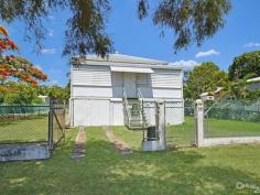 14 Seventh Ave South Townsville QLD 4810 Early 1900's Queenslander Classic!!! Auction Details: Sat 20/12/2014 10:30 AM "Phone for an Inspection". STREET AND 2 LANEWAY ACCESS!!! If there is an Auction you must attend and be an active bidder at this year it will have to be this one. Being held at 10.30am on Saturday 20th December this would be the perfect Christmas present for the family. Structually sound and with the addition of a few modern conveniences you could be in your new home straight away. Built in the early 1900's this home has a lot of history and has seen some changes along the way with the old timber gidgee post having been replaced with concrete and steel stumps. Also the front verandah has been closed in and turned into a sleepout. The original railings and fancy carved fretwork have been preserved and are covered over making it easy to bring back to the original look. (Refer to the black & white photo) There are three bedrooms, combined dining and kitchen, separate lounge plus bathroom upstairs with a separate toilet. Downstairs is lockable with room for one car, plenty of workshop space, laundry and a second toilet.