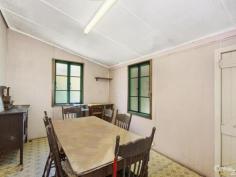 14 Seventh Ave South Townsville QLD 4810 Early 1900's Queenslander Classic!!! Auction Details: Sat 20/12/2014 10:30 AM "Phone for an Inspection". STREET AND 2 LANEWAY ACCESS!!! If there is an Auction you must attend and be an active bidder at this year it will have to be this one. Being held at 10.30am on Saturday 20th December this would be the perfect Christmas present for the family. Structually sound and with the addition of a few modern conveniences you could be in your new home straight away. Built in the early 1900's this home has a lot of history and has seen some changes along the way with the old timber gidgee post having been replaced with concrete and steel stumps. Also the front verandah has been closed in and turned into a sleepout. The original railings and fancy carved fretwork have been preserved and are covered over making it easy to bring back to the original look. (Refer to the black & white photo) There are three bedrooms, combined dining and kitchen, separate lounge plus bathroom upstairs with a separate toilet. Downstairs is lockable with room for one car, plenty of workshop space, laundry and a second toilet.