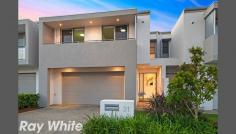 31 Central Park Avenue, Bella Vista, NSW Arguably The Best In The Estate AUCTION THIS SATURDAY @ 1 pm - open half hour prior-.Offering THREE DISTINCT LIVING AREAS, embracing a designer feel with superior finishes throughout this dual level residence has been intuitively crafted to create a light filled sanctuary of quality and space. Located in a commanding position with a NORTHERLY ASPECT TO REAR, overlooking the meticulously maintained parkland from the alfresco BBQ area, thru level wide opening stackable glass doors that flow to formal/informal living and gourmet kitchen. This modern residence only just close to new has been individually upgraded to cater to those looking for a low maintenance luxurious lifestyle conveniently close to all Bella Vista has to offer. Set just a short walk to the future Norwest Station Quality amenities such as GENEROUS POOL, GYM & CABANA Stream lined open living flowing effortlessly to courtyard A lifestyle home that will win your heart