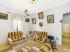 14 Seventh Ave South Townsville QLD 4810 Early 1900's Queenslander Classic!!! Auction Details: Sat 20/12/2014 10:30 AM "Phone for an Inspection". STREET AND 2 LANEWAY ACCESS!!! If there is an Auction you must attend and be an active bidder at this year it will have to be this one. Being held at 10.30am on Saturday 20th December this would be the perfect Christmas present for the family. Structually sound and with the addition of a few modern conveniences you could be in your new home straight away. Built in the early 1900's this home has a lot of history and has seen some changes along the way with the old timber gidgee post having been replaced with concrete and steel stumps. Also the front verandah has been closed in and turned into a sleepout. The original railings and fancy carved fretwork have been preserved and are covered over making it easy to bring back to the original look. (Refer to the black & white photo) There are three bedrooms, combined dining and kitchen, separate lounge plus bathroom upstairs with a separate toilet. Downstairs is lockable with room for one car, plenty of workshop space, laundry and a second toilet.
