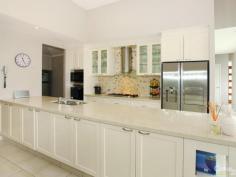 5004 Riverwood Grove Benowa QLD 4217 SINGLE LEVEL AWARD-WINNING HOME Very quiet and private cul-de-sac position. Set on a large 867 Square Meter of land. Impressive kitchen with Miele appliances. Huge butler's pantry, stone benchtops. Large open plan living and dining area. Large laundry, 3 large bedrooms, master with lavish ensuite and spa. Separate office/family room. Separate rumpus/games room. Huge tiled garage for 2 cars plus buggy. Ducted air, security system, 3.5 meter high ceiling, gorgeous pool and 3 outdoor courtyards and expansive rear grassed yard. Plus many many more inclusions. Inspection a must. Motivated vendors ready to meet the market. Contact Sasan Rahmani, The Royal Pines Sales Specialist.