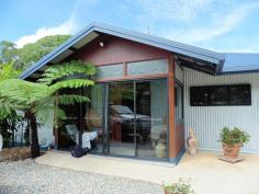 12 Fallon Rd Kuranda QLD 4881 $595,000 QUALITY HOME ON 1 ACRE House - Property ID: 775637 POTENTIAL TO BUILD GARDEN FLAT UNDER HOUSE o Master Bedroom with ensuite and walk in robe o Two other large bedrooms with built in robes o Large open plan kitchen, dining, living area o Sunroom at entrance of home o Sloping block with terraced gardens o Circular Driveway with level entrance to home o Height under house tall enough for Mobile home o Well appointed kitchen with walk in pantry This fabulous 293 sq mtr home has many wonderful features such as large sliding windows and doors in the living area that retract back to give a feeling of indoor / outdoor balcony living. This area expands onto a large undercover north facing verandah. The home is 7 years old and been kept in immaculate condition. The property originally came with an in ground pool that was not required by the current owners. This area has been filled with soil and transformed into a lovely lawned area. The pool can be reverted back to its original state as all plumbing is still in place. A great deal of thought and work has gone into ensuring that the property is well drained. The slope of the land is terraced with rock walls and a large variety of plant species. Privacy is assured as this home cannot be seen from the street and only has 1 neighbour. Print Brochure Email Alerts Features Building Size Approx. - 293 m2 Land Size Approx. - 4054 m2 3 Bed 3 Bath Landscape gardens potential for granny flat large undercover deck Large open plan kitchen master with ensuite