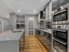 1 Sovereign Place Bridgeman Downs Qld 4035 If waiting for your new home to be built is not in line with your level of patience, then this superbly built and recently completed home is exactly what you are looking for. This double storey home, recently completed in 2014 has attention to detail written all over it, with the owners meticulous attention to the construction of their home. As transfers demand, their loved property is now presented to the market for the first time. Set on 473sqm of low maintenance land, with the home set to one side in a clever design, this North Easterly facing property is modern and edgy and will tick all of your wants and needs. Presenting with 4 bedrooms, The Master Suite with walk through robe, edgy, dual sink, caesar stone top vanity with frameless glass, double shower with multiple shower heads, and luxury at every turn. The other 3 bedrooms all have ceiling fans, built ins and are generous in size. The family bathroom is also edgy, with ceasar stone tops in keeping with the design of the home, and is centrally located. Also on the upper level is an informal lounge, giving direct access to the glass framed verandah with views to the East and the North. At the top of the stairs is a conveniently located study nook. On the lower level you are spoilt for choice. A delightful media room, a home office, a large light filled family room. Superb solid timber floors (Tasmanian Oak) throughout link to the glass framed inground magna pool across a blackbutt hardwood deck and undercover alfresco area. The centrally positioned kitchen is a chefs delight in every respect. With Caesar Stone benchtops, island style bench with Bosch Stainless Steel appliances, gas cooktop, electric oven, steam oven, stainless steel rangehood and dishwasher, it will be your kitchen that rules! A huge walk in pantry, double fridge space, glass fronted and 2 pak cabinetry and cupboards and storage in abundance make this an absolute chefs delight in every respect. Additionally, the home has been wired and ducted ready for Ducted Airconditioning, has double auto garaging with direct, secure access to the home, a downstairs powder room, laundry with caeser stone benchtops and 2 pak cabinetry, pool pavillion adjacent to the pool area, full rendered walls and fencing around the entire perimeter with every detail of the home complete. With the builders warranty in place and some appliance warranties still to run, this fully completed home will suit the most fastidious buyer. Upper Level 1 Master bedroom, ensuite, walk through robe, balcony, ceiling fan 3 Bedrooms, built-ins, ceiling fan 1 Family bathroom Living area, access to balcony Study nook Lower Level Kitchen with stonetop benches, gas cooktop Media room Spacious living area & dining area Pool pavillion Powder room Laundry 473m2 block Undercover entertaining deck with blackbutt hardwood Swimming pool Double car garaging