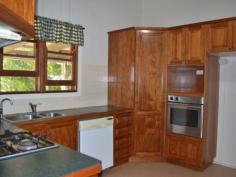 22 Meson Street Gayndah Qld 4625 $275,000 Beautifully Restored Queenslander - Entertainers Delight * 4 good sized bedrooms - 2 with walk in dressing rooms * Returning $285 p/w on a long term lease * Beautiful timber kitchen with ample bench space, dishwasher, gas cooktop + servery * Huge entertaining deck overlooking the back yard * Bathroom features shower over bath & linen cupboard * Polished wooden floors in lounge & front entry room * 3 reverse cycle A/C + ceiling fans * Large 1,363m2 allotment - plenty of room to watch the kids play from the back deck * Centrally located - stone throw away from schools and shops Property Snapshot Property Type: House Land Area: 1,363 m2