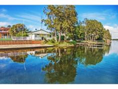 106A Main Rd Toukley NSW 2263 33 Day Sale if not sold prior to 17th Feb 2015 $510,000-$590,000 The Best of Both Worlds Has Arrived In what could be described as one of the most unique North-facing waterfronts on Tuggerah Lakes, this wonderful cottage will be the envy of all your friends. With a unique existing use right this property almost laps the water’s edge and perfect for all water sports activities. Set facing a Northerly direction, this two bedroom home is of generous size and has an outstanding view across the lake for those magical sunrises of a morning. With the potential to improve the current granny flat for friends or family or even a studio/ office/ music room, your life style will be the sea change that you always desired. Position has never been more applicable be sure to inspect today, call Darin Butcher. Absolute waterfront Outstanding views Dream lifestyle 2 bedroom + granny flat 481 sqm block Prime position close to all major shops and public transport View: By appointment Value @ $590,000 Agency: Wiseberry Heritage Agent: Darin Butcher DISCLAIMER: This advertisement contains information provided by third parties. While all care is taken to ensure otherwise, Wiseberry Heritage, Wiseberry Charmhaven and Wiseberry Wyong does not make any representation as to the accuracy of any of the information contained in the advertisement, does not accept any responsibility or liability and recommends that any client make their own investigations and enquiries. All images are indicative of the property only. Property Features: 1 Building2 Bedroom1 Bathroom1 Living Room120m2 Building SizeRendered ConstructionContemporary StyleGood Condition2 Parking481m2 Land Size1 BackyardR2 Zoning