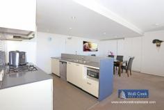 A1803/35 Arncliffe St Wolli Creek NSW 2205 $865,000 A rare opportunity to purchase this modern 2 bedroom apartment on level 18 in Proximity building, spacious floor plan with 180 degree panoramic views of the airport, cooks river and botany bay. Features include 2 bedroom, ensuite, built-ins, open plan kitchen with caesar stone bench tops, gas cooking, dishwasher and stainless steel appliances plus 1 security car space. Complex offers lap pool, sauna and gym. Short walk to new Woolworths super market and train station. Strata approx $1700p/q, council approx $268 p/q and water approx $168p/q. Property: Apartment Bedrooms: 2 Bathrooms: 2 Parking: 1 Council: Rockdale