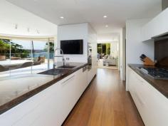 301/11 Esplanade Elizabeth Bay NSW 2011 DETAILS ID #: 0000247448 Price: Expressions of Interest Type: Apartment Bed: 5 Bath: 5 Car: 4 'Villa Caprera' - Whole Floor Palatial Luxury Opposite Park & Harbour Enjoying an ideal Northerly aspect and sublime views of waterfront Beare Park, the shimmering Harbour and NYE fireworks, this dream private oasis is the largest in an award-winning boutique security block of just 8. Architecturally inventive and glamorously appointed for contemporary easy living and entertaining with minimal upkeep, this vast indoor/outdoor apartment is perfect for downsizers or a young family. Masterbuilt and occupying an entire floor in a coveted harbourside cul-de-sac position, the apartment's sleek sophistication offers incredible versatility, absolute security and quiet privacy. A short walk to elite Elizabeth Bay marina, Rushcutters Bay tennis courts or high-fashion Potts Point shopping, dining and transport choices, this magnificent apartment is also just minutes to the CBD by water taxi. * Level lift access directly into your private lobby and reception foyer * 2 huge open plan living/dining rooms flow to 2 large alfresco terraces * Marble Miele Gaggenau gas gourmet kitchen, walk-in pantry, cocktail bar * 2 opulent master wings with marble ensuites, walk-in robes, terrace access * Separate study zone, 2 additional large bedrooms, 1 with marble ensuite * Large separate fully-equipped home theatre/rumpus room or 5th bedroom * Marble guest powder room, marble main bathroom, internal laundry room * High ceilings, abundant storage, sensor-lit wardrobes, motorised blinds * Stone terraces, travertine or wide-planked timber floors, silk carpet in bedrooms * Ducted A/C (all rooms separately controlled), surround sound, no common walls * Motorised awnings, lush low-maintenance landscaping and vertical garden * 4-car security garage (internal access), comprehensive back-to-base alarm