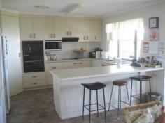 13 Aplin St Point Vernon QLD 4655 ID #: 0000245331 Price: $675,000 Type: House Bed: 4 Bath: 3 Car: 2 Land Area: 1095 sqm (approx Relaxed living with this balanced designed two storey residence perfect for dual living. Downstairs Large double garage with internal access to entry, spacious lounge with kitchette, separate laundry, bathroom and external covered patio over looking Esplanade with sea views and parkland. The spacious upper level has open plan lounge/family, kitchen/dining overlooking ocean with access to large covered verandah with sea views . All bedrooms have built in robes, Master has access to verandah, There is separate laundry and spacious bathroom. This property represents excellent value at $675,000. A recommended R&W purchase.