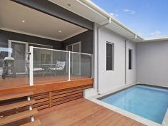 10 Westwood Street Banora Point NSW 2486 Contemporary Living at Its Best This striking home offers contemporary Australian family living at its best. If you've always wanted a low maintenance home set amongst nature, and also have every convenience at your fingertips, the complete package is presented here. Firstly, the layout of this quality builder's own home offers a range of attractive options. You may choose to accommodate your large family, set up a teenager's retreat, or enjoy the benefit of working from home with plenty of room to move. Throw open the sliding glass stacker doors to relax or entertain on the timber deck, with the gentle sound of majestic birdsong in the background, take a cooling dip in the private plunge pool, then perhaps move inside to enjoy a movie night in your own family-sized media room. Cooking is a pleasure in the designer kitchen, which offers a large walk-in pantry, gas cooktop, stainless steel range hood and dishwasher, plus stylish industrial-style feature lighting above the sleek stone bench tops. The open plan living and dining areas offer a spacious ambience and feature easy-care Blackbutt laminate flooring throughout. Your master suite offers a large walk-in robe, with an open ensuite showcasing feature tiles behind the dual vanity plus private toilet and shower. There are four additional bedrooms, all with built-in robes and brushed aluminium ceiling fans, three bathrooms in total plus a very spacious rumpus room. Just some of the extras include; Auto double garage with internal entry, high ceilings, fenced rear yard, under house storage and water tank. Owners keen to move on and have requested all offers be submitted.