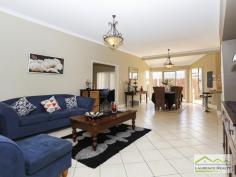 45 Seville Crest Mindarie WA 6030 For Sale $699,000 - $749,000 You can change anything in a house but you can never change the location and that is where this home screams great value. There is absolutely no need to change the size because this home is enormous. You have massive bedrooms, formal lounge/dining, separate games room, a study which could easily be the 5th bedroom and a more than spacious kitchen/meals all boasting high ceilings. This property is located on one the loveliest streets, a very quiet and elevated spot on a good sized plot of land (680sqm) with plenty of room for a swimming pool if desired. The value of this property would rise dramatically with any sort of renovations because of the generous size and the location. Here is a snap shot of the features: Double Door Entry Huge Lounge/Dining ideal to convert into a theatre and study Five Bedrooms all more than adequate to accommodate Queen sized beds with the master being huge and framed by a bank of windows ? so pretty Very generous ensuite and walk in robe separate WC, big bath and double sink vanity Large open planned meals/family/kitchen Extremely large kitchen allowing any budding chef to cook up a storm with wall oven and hot plate, stainless steel dishwasher and double fridge recess Access from the double garage into the kitchen, Separate Games Room or can be the theatre room Sliding glass doors lead out to the patio from the meals area Good sized patio with room at the back for the kids to play or install a pool in required Split system air conditioners Alarm System Built approximately 1998 267 m2 (approx.) of home on a 680sqm block of land Awesome location for quiet suburban living