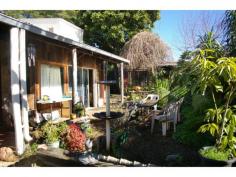 39 Warren Rd Nannup WA 6275 $450,000 Key Details property ID 322729 land size 892.00m2 Description ARTIST'S HOME, STUDIO AND REGULAR INCOME This artist’s home is full of character and features, stone walls, shaded gardens and total privacy. Use the huge art studio at the back of the block for painting, sculpture or just whiling away the hours doing your own thing. Live the lifestyle while you earn an income from the large shop out front. Zoned commercial/residential it combines a substantial shop front currently leased to a well-respected business and a private residence with studio/workshop to the rear.