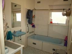 18 Market Street Tahmoor NSW 2573 Price: $365,000 Located close to town on a level 1012m² corner block is this potential gold mine! At present there is a renovated (inside) two bedroom home, one with built in robe, basic kitchen and bathroom, good size living area with split system r/c air con and polished timber flooring throughout. There is recently completed kerb and guttering to one frontage and all services available. Please note this property is currently tenanted and require 48 hours notice prior to inspections.