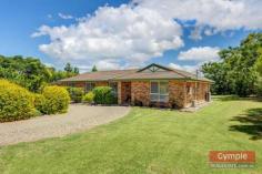 23 Running Creek Rd Kilkivan QLD 4600 $345,000.00 *4 bedroom, 2 bathroom lowset brick home *Media room or 5th bedroom, formal entry *Open plan kitchen, dining & living area *Sec screens, ceiling fans, air conditioning *Huge undercover patio & BBQ area *11m x 4m x 3.5m shed plus 6m x 3.5m shed *2 x carports, 3KW solar, 2 x 10,000L tanks *Fully fenced 1 acre, fire pit & views FOR SALE: $345,000 Nothing more to do, nothing more to spend! Just sit back, relax and enjoy yourself in a superb, quality home whilst enjoying the quaint, rural, country town charm and lifestyle that Kilkivan has to offer! * Beautifully maintained and presented, quality lowset brick veneer home * 4 large carpeted bedrooms all with ceiling fans and built in wardrobes * Main bedroom features large built ins, air conditioning and huge modern ensuite * Separate media room, could be used as a 5th bedroom option or guest sleep-out * Formal entry leads to tiled open plan kitchen, dining and air conditioned lounge * Lounge opens onto huge, private undercover pebblecrete patio and BBQ area * Large kitchen with modern, quality appliances, loads of storage and big pantry * Roomy laundry with linen storage and easy access to patio and clothesline * Security screens, blinds and ceiling fans throughout, satellite TV * Large 11m x 4m x 3.5m shed with high clearance roller door, suitable for caravan or boat * 6m x 3.5m lockable, powered shed with workbench can be used as extra garage * 2 x extra carports with shade screens, 3KW solar system * Connected to town water supply with the added bonus of 2 x 10,000L rainwater tanks * Fully fenced one acre block with lovely established trees and gardens * Quality landscaping, fire pit, privacy and views of the mountains * 1km to town, school bus service to Gympie high schools, less than 40 mins to Gympie * Central to Gympie, Goomeri, Murgon, Bjelke-Petersen Dam and the South Burnet wine trail All of this within walking distance to Kilkivan town with cafes, shops, hotel, primary school, parks and sport facilities. This is affordable, quality living, central to everything the South Burnett and Gympie regions have to offer! Copy & paste the following link to view property video:- http://youtu.be/P6_WcjKGOuk Disclaimer All the above property information has been supplied to us by the Vendor. We do not accept responsibility to any person for its accuracy and do no more than pass this information on. Interested parties should make and rely upon their own enquiries in order to determine whether or not this information is in fact accurate. Intending purchasers should seek legal and accounting advice before entering into any contract of purchase.