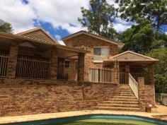5/30 Dorset Drive "Cornwall Close" Springwood Qld 4127 $692,000 Features General Features Property Type: House Bedrooms: 4 Bathrooms: 2 Land Size: 2003 m? (approx) Indoor Ensuite: 1 Living Areas: 3 Toilets: 2 Built in Wardrobes Dishwasher Split system Air Conditioning Ducted Heating Open Fireplace Outdoor Remote Garage Garage Spaces: 2 Deck Outdoor Entertaining Area Swimming Pool - Inground Inspections Inspections by appointment only. Set in a private court this architecturally designed property is one of a kind. The home takes full advantage of the gently slopping 1/2 acre block with several different levels of living which overlook the large outdoor entertainment areas and inground pool. The main bedroom is big enough for a parents retreat and also has a walk in robe and very modern ensuite. On this same level is a study or office area. The other 3 built-in bedrooms are on the lower level with the modern family bathroom and large laundry. The kitchen has many cupboards, pantry, dishwasher and gas hotplates, it also overlooks the pool and the beautiful bushland at the rear of the home. Close to Schools and local shops with only a short drive to access the freeway north and south - this is a very good location.