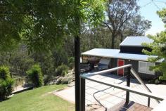 205 Oxley Drive Mittagong NSW 2575 $1,250,000 EMBRACING A SUPERB MASTERBUILT HOME WITH A MAGICAL OUTLOOK SET ON 1.6 ACRES ON THE NORTHERN SIDE OF 'THE GIB' FEATURES OPEN PLAN LIVING WITH GREAT STYLE AND PRESENTATION * 5 bedrooms - all with built-in robes * main upstairs with WIR & split-system air conditioning * 2 bathrooms with under-floor heating - ensuite to main * main bathroom - generous in size, with claw foot bath, frameless shower, Caesar stone vanity & w.c. * powder room with vanity & under-floor heating * open plan lounge & dining with vaulted ceilings, blackbutt parquetry flooring, Jetmaster open fire, ceiling fans, window seat & French doors to north facing deck * well appointed kitchen with granite benchtops, Ilve electric oven & 5 burner gas cookop, dishwasher & butler's pantry * rumpus/media room - sound proofed * study/office * large laundry with plenty of storage & under-floor heating * ducted gas central heating * security alarm system