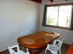 6 Merry Street Kioloa NSW 2539 OFFERS MID $300,000 This unique ‘chalet’ style beachside cottage is located in a quiet cul-de-sac and is less then 300m from gorgeous Merry Beach or 5 minutes walk from the unspoilt Murramarang National Park. Offered fully furnished, you could buy today and spend quality time with the family next weekend. Features include 2 bedrooms, a loft which could be a third bedroom/child’s play area, separate dining, carport and laundry/storage room. In its current configuration the home easily accommodates 2 adults and 3 children.