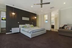 51 Craig Parry Drive Hidden Valley Vic 3756 4232Price Guide: Interest from $630,000 | Type: House | ID #208496 Resort Style Living on the 5th Green Leave the hustle and bustle behind you as you arrive home to relax in this alluring abode. With the beautiful Hidden Valley golf course as a backdrop, you can sit back, relax and unwind in the spacious eleven person spa offered by this premium property. Set adjacent to the green on a generous 1494m2 allotment, this attractive family home offers superb attention to detail, coupled with modern functionality. The open plan living includes kitchen, family and dining rooms with frameless glass stacker doors that overlook the large alfresco area. The galley kitchen features stone bench tops and splashback, double-sided breakfast bar, double wall oven and 900mm gas cook top, all adjacent to a spacious butler's pantry. A separate theatre room provides a great hideaway for the movie enthusiast, or a place to relax and enjoy the warmth of a gas log fireplace. The master suite includes a mirrored glass walk in wardrobe, en suite and an opulent stone bath tub to unwind in after a long day. The remaining three bedrooms feature built in mirrored wardrobes and are set amongst another stunning bathroom with separate toilet. Outside, the triple garage offers three metre high doors which can accommodate a horse float or caravan, with still enough space for two or more vehicles. Additionally, the garage includes built in cabinetry with sink and a rear roller door. Landscaped gardens, exposed aggregate driveway, secure pet fencing plus much, much more. This is truly a fine home. **Sale By Set Date - Tuesday 31st March 2015 at 5pm*