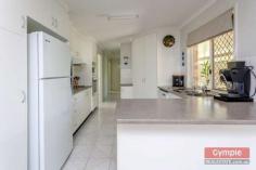 23 Running Creek Rd Kilkivan QLD 4600 $345,000.00 *4 bedroom, 2 bathroom lowset brick home *Media room or 5th bedroom, formal entry *Open plan kitchen, dining & living area *Sec screens, ceiling fans, air conditioning *Huge undercover patio & BBQ area *11m x 4m x 3.5m shed plus 6m x 3.5m shed *2 x carports, 3KW solar, 2 x 10,000L tanks *Fully fenced 1 acre, fire pit & views FOR SALE: $345,000 Nothing more to do, nothing more to spend! Just sit back, relax and enjoy yourself in a superb, quality home whilst enjoying the quaint, rural, country town charm and lifestyle that Kilkivan has to offer! * Beautifully maintained and presented, quality lowset brick veneer home * 4 large carpeted bedrooms all with ceiling fans and built in wardrobes * Main bedroom features large built ins, air conditioning and huge modern ensuite * Separate media room, could be used as a 5th bedroom option or guest sleep-out * Formal entry leads to tiled open plan kitchen, dining and air conditioned lounge * Lounge opens onto huge, private undercover pebblecrete patio and BBQ area * Large kitchen with modern, quality appliances, loads of storage and big pantry * Roomy laundry with linen storage and easy access to patio and clothesline * Security screens, blinds and ceiling fans throughout, satellite TV * Large 11m x 4m x 3.5m shed with high clearance roller door, suitable for caravan or boat * 6m x 3.5m lockable, powered shed with workbench can be used as extra garage * 2 x extra carports with shade screens, 3KW solar system * Connected to town water supply with the added bonus of 2 x 10,000L rainwater tanks * Fully fenced one acre block with lovely established trees and gardens * Quality landscaping, fire pit, privacy and views of the mountains * 1km to town, school bus service to Gympie high schools, less than 40 mins to Gympie * Central to Gympie, Goomeri, Murgon, Bjelke-Petersen Dam and the South Burnet wine trail All of this within walking distance to Kilkivan town with cafes, shops, hotel, primary school, parks and sport facilities. This is affordable, quality living, central to everything the South Burnett and Gympie regions have to offer! Copy & paste the following link to view property video:- http://youtu.be/P6_WcjKGOuk Disclaimer All the above property information has been supplied to us by the Vendor. We do not accept responsibility to any person for its accuracy and do no more than pass this information on. Interested parties should make and rely upon their own enquiries in order to determine whether or not this information is in fact accurate. Intending purchasers should seek legal and accounting advice before entering into any contract of purchase.