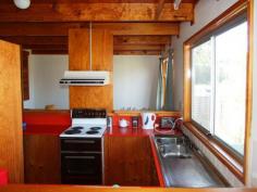 6 Merry Street Kioloa NSW 2539 OFFERS MID $300,000 This unique ‘chalet’ style beachside cottage is located in a quiet cul-de-sac and is less then 300m from gorgeous Merry Beach or 5 minutes walk from the unspoilt Murramarang National Park. Offered fully furnished, you could buy today and spend quality time with the family next weekend. Features include 2 bedrooms, a loft which could be a third bedroom/child’s play area, separate dining, carport and laundry/storage room. In its current configuration the home easily accommodates 2 adults and 3 children.