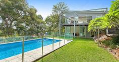 101 Woodland St S Balgowlah Heights NSW 2093 This quality architect designed home is only 6 years old and offers perfect family living on a level 730m2 block. The home has been designed to maximize the light and the vista of its leafy surrounds. The residence is set over two levels and has smart indoor/outdoor living and entertaining options connecting to the beautiful native gardens, level lawn area and the salt water swimming pool. The upper level features an expansive open plan kitchen - living - dining area that flows onto large entertaining terraces at either end of the house. The Eastern one has leafy district and water views spanning down to North Harbour while the other overlooks the impressive garden and pool. The kitchen is stunning with extensive storage space and quality European gas and electric appliances. The CaesarStone island bench allows friends somewhere to sit for a casual get together over a coffee or a glass of wine. You won't ever feel the need to leave as upstairs has a cleverly designed home office with built-in desks, shelves and cupboards, where concealed sliding doors close off the space for complete privacy. The master suite has enough built-in wardrobe space to satisfy anyone and opens to the front terrace providing parents a quiet retreat. Upstairs also has a generous 4th bedroom with built-in wardrobe and easy access to the Western terrace. The lower level provides a great separate zone for young children or teenagers. Two large bedrooms open out onto lush gardens with private views of the adjoining native reserve. The family room opens to the level lawn and pool area offering a superb space for children to play and party. There is also a music/yoga room and a huge laundry connecting directly to the garden and drying area. At the front of the house is a substantial storeroom to safely keep your family's bikes, surfboards and golf clubs. The location is excellent being close to local shops, schools, beaches, public transport and beautiful North Harbour. There are so many extra features that make this house stand out from the crowd that an inspection is a must if you are after a luxury home in the area. Inspect: Sat / Wed 10.15am -10.45am Auction: Saturday 18th April 2015