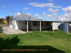 22 Granite St Stanthorpe QLD 4380 $185,000 4 bedroom low set residence Separate lounge Country style kitchen with gas stove & wood stove with wet back hot water system Modernized bathroom with shower Wood burning fire box Large carport at rear plus a store room Rental? - $240 per week return Iron roof, rendered exterior, town water & sewerage Fully fenced ¼ acre allotment handy to town CBD and Quartpot Creek parklands This is a sturdy home with plenty of space and in a handy position. Category House Property ID H2999