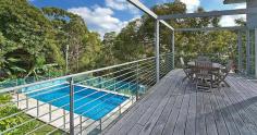 101 Woodland St S Balgowlah Heights NSW 2093 This quality architect designed home is only 6 years old and offers perfect family living on a level 730m2 block. The home has been designed to maximize the light and the vista of its leafy surrounds. The residence is set over two levels and has smart indoor/outdoor living and entertaining options connecting to the beautiful native gardens, level lawn area and the salt water swimming pool. The upper level features an expansive open plan kitchen - living - dining area that flows onto large entertaining terraces at either end of the house. The Eastern one has leafy district and water views spanning down to North Harbour while the other overlooks the impressive garden and pool. The kitchen is stunning with extensive storage space and quality European gas and electric appliances. The CaesarStone island bench allows friends somewhere to sit for a casual get together over a coffee or a glass of wine. You won't ever feel the need to leave as upstairs has a cleverly designed home office with built-in desks, shelves and cupboards, where concealed sliding doors close off the space for complete privacy. The master suite has enough built-in wardrobe space to satisfy anyone and opens to the front terrace providing parents a quiet retreat. Upstairs also has a generous 4th bedroom with built-in wardrobe and easy access to the Western terrace. The lower level provides a great separate zone for young children or teenagers. Two large bedrooms open out onto lush gardens with private views of the adjoining native reserve. The family room opens to the level lawn and pool area offering a superb space for children to play and party. There is also a music/yoga room and a huge laundry connecting directly to the garden and drying area. At the front of the house is a substantial storeroom to safely keep your family's bikes, surfboards and golf clubs. The location is excellent being close to local shops, schools, beaches, public transport and beautiful North Harbour. There are so many extra features that make this house stand out from the crowd that an inspection is a must if you are after a luxury home in the area. Inspect: Sat / Wed 10.15am -10.45am Auction: Saturday 18th April 2015