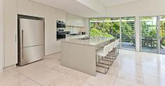101 Woodland St S Balgowlah Heights NSW 2093 This quality architect designed home is only 6 years old and offers perfect family living on a level 730m2 block. The home has been designed to maximize the light and the vista of its leafy surrounds. The residence is set over two levels and has smart indoor/outdoor living and entertaining options connecting to the beautiful native gardens, level lawn area and the salt water swimming pool. The upper level features an expansive open plan kitchen - living - dining area that flows onto large entertaining terraces at either end of the house. The Eastern one has leafy district and water views spanning down to North Harbour while the other overlooks the impressive garden and pool. The kitchen is stunning with extensive storage space and quality European gas and electric appliances. The CaesarStone island bench allows friends somewhere to sit for a casual get together over a coffee or a glass of wine. You won't ever feel the need to leave as upstairs has a cleverly designed home office with built-in desks, shelves and cupboards, where concealed sliding doors close off the space for complete privacy. The master suite has enough built-in wardrobe space to satisfy anyone and opens to the front terrace providing parents a quiet retreat. Upstairs also has a generous 4th bedroom with built-in wardrobe and easy access to the Western terrace. The lower level provides a great separate zone for young children or teenagers. Two large bedrooms open out onto lush gardens with private views of the adjoining native reserve. The family room opens to the level lawn and pool area offering a superb space for children to play and party. There is also a music/yoga room and a huge laundry connecting directly to the garden and drying area. At the front of the house is a substantial storeroom to safely keep your family's bikes, surfboards and golf clubs. The location is excellent being close to local shops, schools, beaches, public transport and beautiful North Harbour. There are so many extra features that make this house stand out from the crowd that an inspection is a must if you are after a luxury home in the area. Inspect: Sat / Wed 10.15am -10.45am Auction: Saturday 18th April 2015