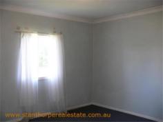22 Granite St Stanthorpe QLD 4380 $185,000 4 bedroom low set residence Separate lounge Country style kitchen with gas stove & wood stove with wet back hot water system Modernized bathroom with shower Wood burning fire box Large carport at rear plus a store room Rental? - $240 per week return Iron roof, rendered exterior, town water & sewerage Fully fenced ¼ acre allotment handy to town CBD and Quartpot Creek parklands This is a sturdy home with plenty of space and in a handy position. Category House Property ID H2999