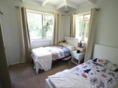 874 Terania Creek Rd Terania Creek NSW 2480 $575,000 Approximately 50 lush acres positioned 10 minutes drive from the beautiful Nightcap National Park and Protestors Falls. Recently renovated 4 bedroom home. The modern, refurbished kitchen includes a butchers bench and five burner gas stove. The kitchen opens out into an airy dining/living area that has polished timber floors and sliding doors that lead out onto beautiful, wide verandahs. There is a private, second dwelling that has been recently renovated and offers self-contained living and privacy from the main house. Huge, undercover area that has enough room for four cars! Tastefully landscaped with a terraced vegetable garden and walking tracks that take in the large variety of fruit trees. Access to your very own, secluded swimming hole positioned on Terania Creek. Photos do not do it justice! Solar hot water, 3x 5000 gallon (total approx 60,000 litres) tanks and mains power. Phone reception and internet available. The acreage has a balance of cleared, elevated areas with views over Terania Creek Valley and beautiful, ancient stands of rainforest. There is also a second creek and dam located on the property. A school bus goes past the front gate. With so much to offer, why not inspect